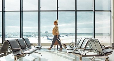 Adult person walking through airport